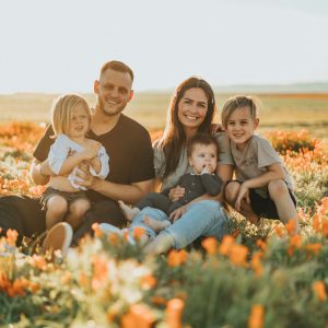 family of five in a field